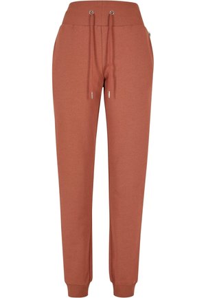 Rustoransje joggebukser laget av myk stoff, med ribbestrikket midjebånd, justerbare snorer og tettsittende mansjetter ved anklene.
