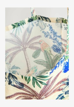 Znovu použitelné taška vyrobená z látky s tropickým květinovým a ptákem potiskem v živých barvách. Interiér má světle pozadí.