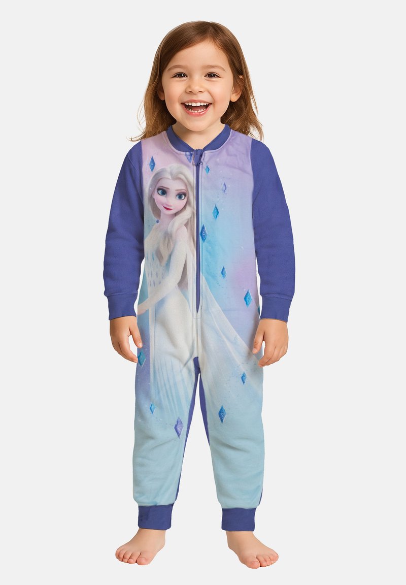 Pigiama intero in morbido pile, presenta una parte superiore viola con una grafica di un personaggio e una parte inferiore blu. Chiusura con zip e polsini a coste.