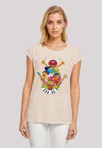 Short-sleeve beige T-shirt made of cotton, featuring a colorful cartoon design with musical characters and instruments.