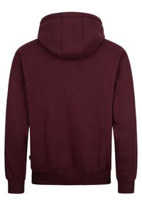 Felpa bordo con cappuccio regolabile, polsini a coste e vita a coste, realizzata in un morbido tessuto testurizzato. Design posteriore semplice.