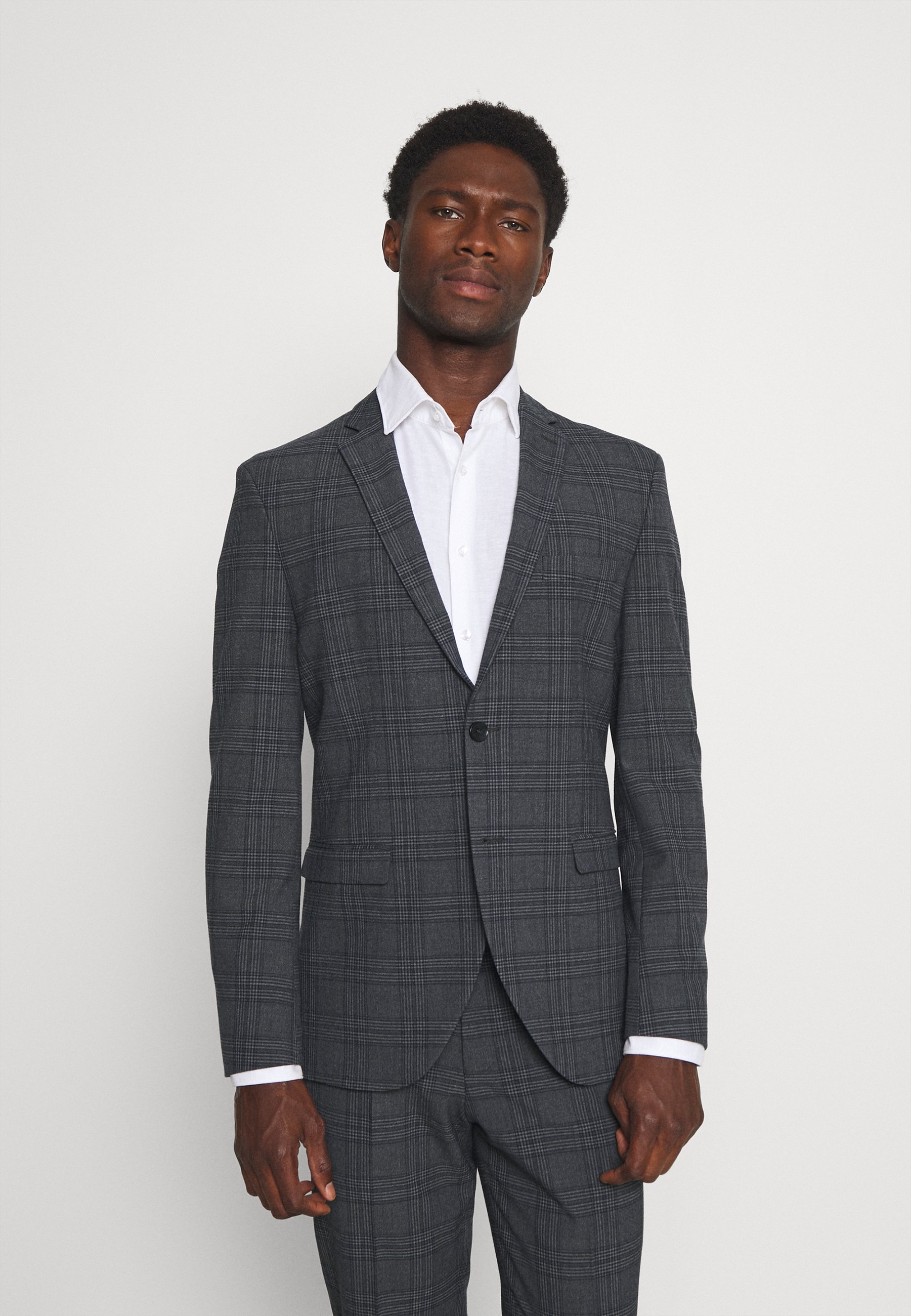 checkered suit with turtleneck
