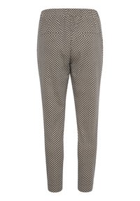 Byxor med elastisk midja i en beige tyg med ett svart geometriskt mönster. Slim fit med avsmalnande ben och inga synliga fickor.