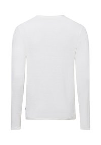 Camicia bianca in cotone a maniche lunghe con tessuto testurizzato, scollatura rotonda e orlo dritto. Nessun marchio o motivo visibile.