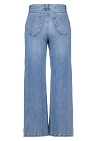 Wijd-uitlopende jeans van lichtblauwe denim, met een hoge taille, twee achterzakken en een zoom met een lichte rafeling.