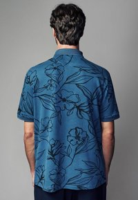 Next REGULAR FIT - PATTERN ZIP NECK - Pólóing - blue black floral