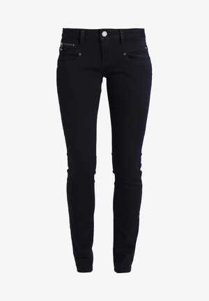 Jeans skinny in denim nero con vita media, tasche frontali e posteriori, e dettagli con zip sui fianchi. Tessuto morbido e elasticizzato.