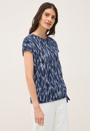 Blauwe blouse met patronen, voorzien van korte mouwen, een ronde halslijn en een trekkoorddetail aan de onderrand voor een op maat gemaakte pasvorm. Lichtgewicht stof.