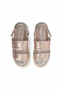 Rose gold sandals with two sequined straps, adjustable ankle buckle, and cushioned sole. Smooth texture and rounded shape.