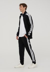 Terranova IN INTERLOCK CON BANDE - Pantaloni sportivi - nero