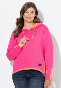 Fuchsia Kapuzenpullover mit orangefarbenen Akzenten, Kordelzug und seitlichen Reißverschlüssen. Hergestellt aus weichem Stoff, besitzt er eine lockere Passform und ein Logopatch.