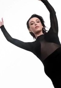 Bodysuit noir transparent à manches longues avec un col montant, mettant en valeur un design ajusté et un tissu superposé, sur fond blanc.