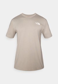 Μπεζ κοντομάνικο T-shirt κατασκευασμένο από βαμβάκι. Διαθέτει λευκό λογότυπο στο στήθος, στρογγυλή λαιμόκοψη και άνετη εφαρμογή. Με λείο υφή.