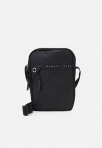 Musta kangasolkaiminen olkalaukku suorakaiteen muotoinen, jossa on etutasku vetoketjulla, logokoriste ja irrotettava säädettävä hihna.