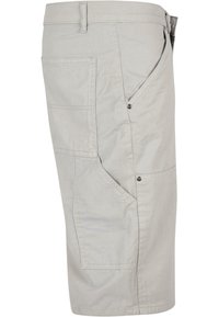 Pantaloni cargo grigio chiaro realizzati in misto cotone, con tasche laterali, dettagli a bottoni e una vestibilità rilassata. Tessuto morbido, lunghezza al ginocchio.