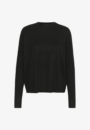 Musta neulottu villapaita pitkillä hihoilla, pyöreällä kaula-aukoilla, väljä malli ja ribbaushelma. Pehmeä tekstuuri, minimaalinen muotoilu, sopii kerroksittain käytettäväksi.