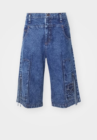Denim cargo shorts in medium blue with front pockets, side cargo pockets, and zipper details. Features a straight cut and textured fabric.