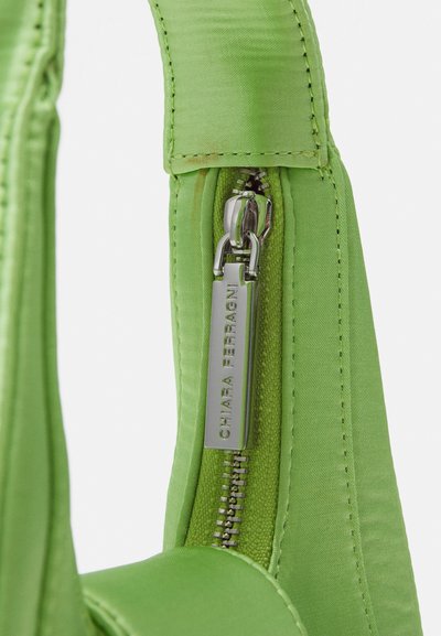 Green satin handbag featuring a silver zipper with a rectangular tag engraved "Chiara Ferragni." Smooth texture and structured shape.