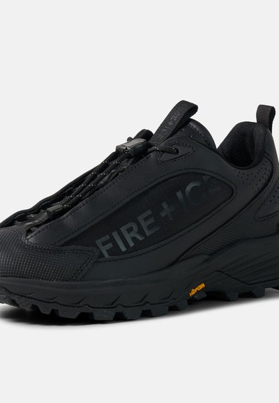 Black athletic shoe with Vibram sole, elastic lace toggle, pull tab, and "FIRE + ICE" branding on the side panel.