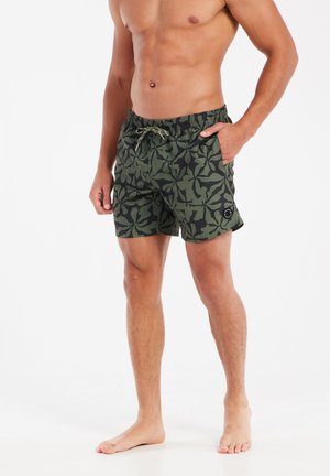 Green patterned swim shorts with an elastic waistband and drawstring detail. Features a short length and side pockets.