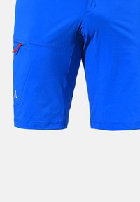 Niebieskie spodenki sportowe z lekkiego materiału, z zamykaną na zamek kieszenią z czerwoną pętelką oraz małym detalem loga na dolnym brzegu.