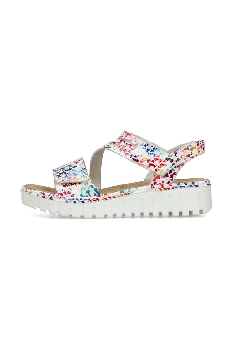 Sandales colorées avec une semelle plate-forme blanche, présentant un motif floral texturé dans des tons de rouge, bleu et orange sur les brides supérieures.