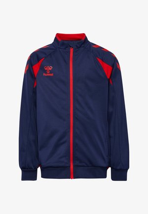 Mørkeblå sportjakke med røde detaljer, fuld lynlås foran og hummel-logo på venstre bryst.