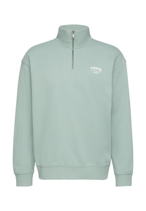 Hellgrüner Sweatshirt mit Reißverschlusskragen, langen Ärmeln, gerippten Bündchen und Abschluss; verfügt über ein kleines weißes Logo auf der Brust. Hergestellt aus weichem Baumwollmaterial.