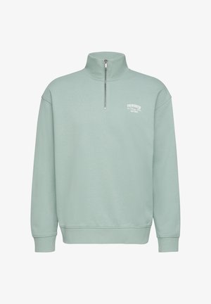 Hellgrüner Sweatshirt mit Reißverschlusskragen, langen Ärmeln, gerippten Bündchen und Abschluss; verfügt über ein kleines weißes Logo auf der Brust. Hergestellt aus weichem Baumwollmaterial.