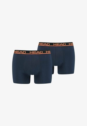 Dunkelblaue Boxer-Shorts aus weichem Stoff, mit einem schwarzen elastischen Bund, auf dem "HEAD" in Orange gedruckt ist. Zwei Paare sind ausgestellt.