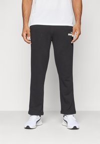 Puma - LOGO PANTS - Tracksuit bottoms - black Thumbnail Image 1