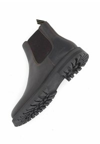 Bottines Chelsea en cuir marron avec panneaux latéraux élastiques, semelle en caoutchouc noir robuste et motif de grip texturé sur la semelle extérieure.