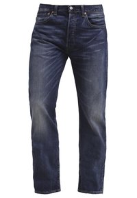 Jean droit en denim bleu foncé avec légère décoloration sur les cuisses et les genoux, doté de poches avant, de passants pour ceinture et d'une fermeture par bouton.