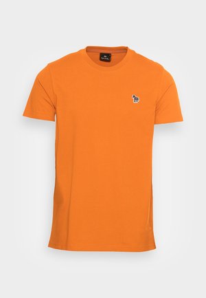 T-shirt orange uni à manches courtes avec un petit logo zèbre sur le côté gauche de la poitrine et un col rond.