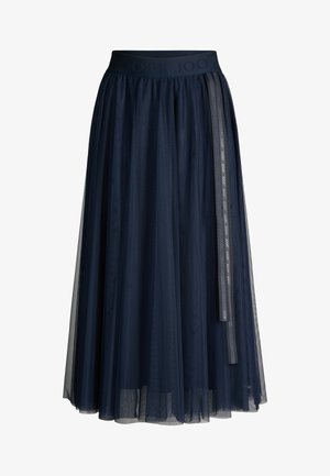 Jupe midi en tulle bleu marine avec ceinture élastique et détail ruban de marque suspendu sur le côté.