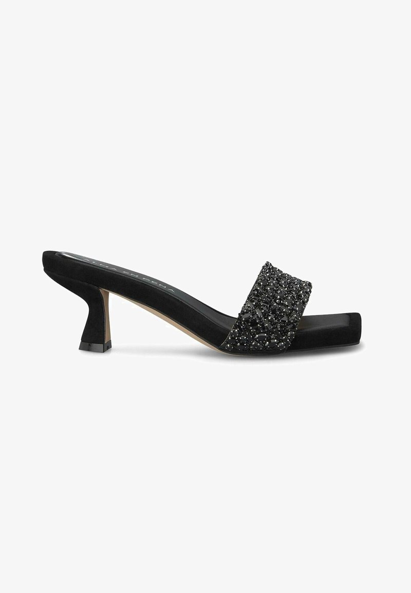 Mule noire à bout ouvert avec petit talon kitten et large bride décorée de petites perles noires et argentées.