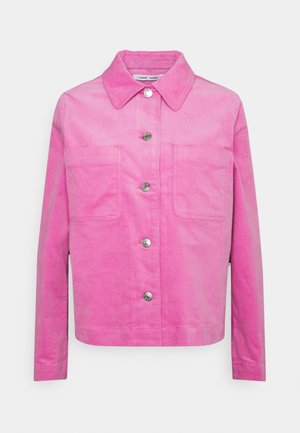 Bright pink corduroy jacket with long sleeves, large front pockets, collar, and silver snap buttons down the center front.
