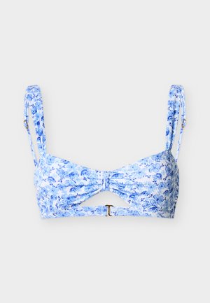 Blue and white floral print bikini top with adjustable shoulder straps and a small cutout below center front clasp.