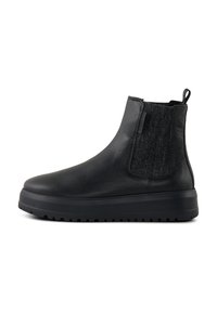 Bottes noires à la cheville en cuir texturé, avec panneaux latéraux élastiques et une semelle en caoutchouc épaisse. Elles sont dotées d'une languette pour un enfilage facile.