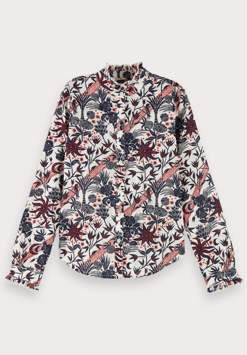 Chemise à manches longues couleur crème avec un motif floral bleu marine et rouge. Dotée d'un col à volants et d'une patte de boutonnage avec des poignets froncés.