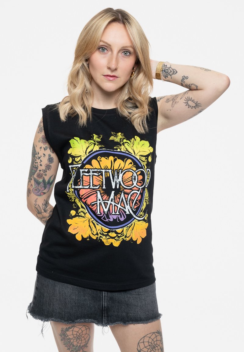 Black sleeveless t-shirt featuring a multicolored "Fleetwood Mac" graphic with floral designs. The fabric appears cotton with a casual fit.
