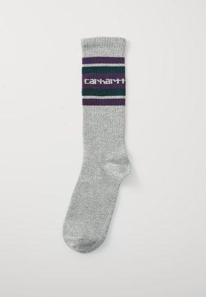 Meia cinza com punho canelado, apresentando um padrão de risca multicolorido em verde, roxo e branco, e um logotipo central em branco.