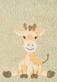 Towel with light green texture featuring embroidered giraffe in tan and brown, with distinct facial features and sitting posture.