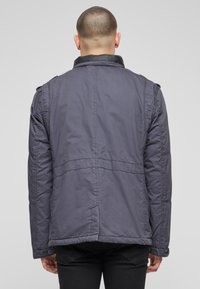 Brandit Zimná bunda - indigo