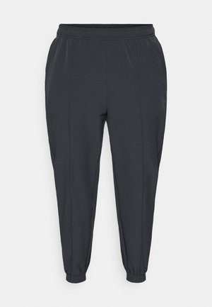 Pantalones jogger gris oscuro hechos de tela suave. Con cinturilla elástica, bolsillos laterales y puños ajustados en los tobillos.