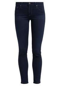 Mörkblå skinny jeans i denim med en klassisk femfickdesign, knapp- och dragkedjestängning samt en slät yta.