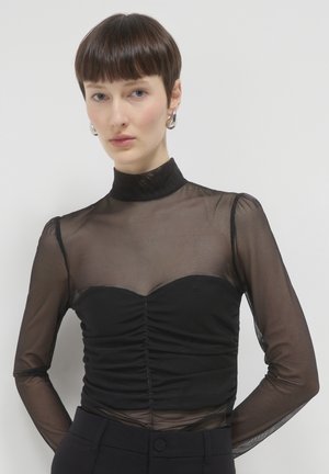 Schwarzes Langarmoberteil aus Netzstoff, mit Stehkragen, gerafftem Oberteil und transparenten Ärmeln. Glattes, figurnahes Design mit subtilem Detail.