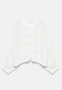 Cardigan blanc tricoté avec manches longues et boutons sur le devant, présentant un motif ajouré et ample ainsi que des poignets et un bas côtelés.