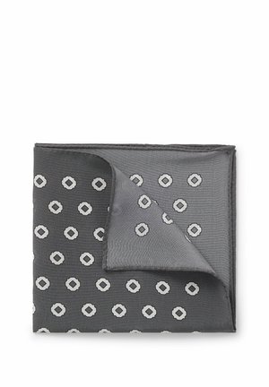 Foldet mørkegråt lommetørklæde med lys grå geometrisk blomsterpattern og et hjørne foldet, så bagsiden vises.