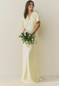Next Apģērbs svinīgiem gadījumiem - pastel yellow